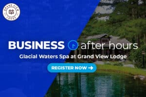 Photo of Glacial Waters Spa at Grand View Lodge exterior showing building surrounded by tall trees and pond with Business After Hours white logo and registration button on top with blue overlay on half of graphic
