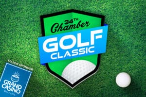 Graphic Image of Green and Blue Chamber Golf Classic logo on top of Grass background with Grand Casino logo on bottom left corner